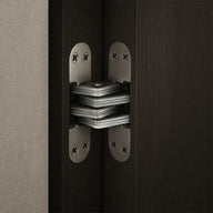 3 way concealed hinge installed on dark wood door with metal plates and screws