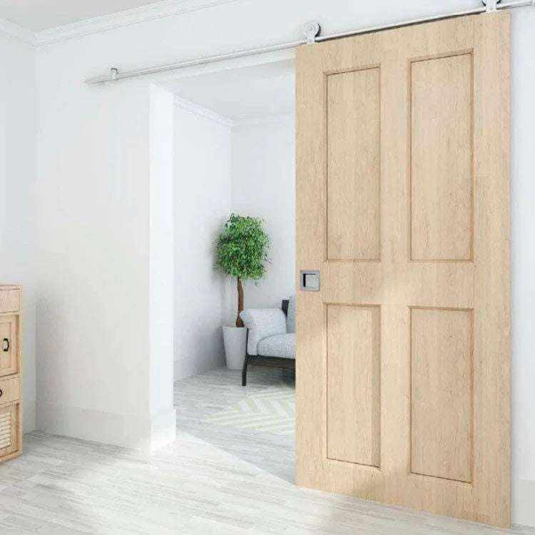 Stainless steel pocket door handle on wooden sliding door in modern interior